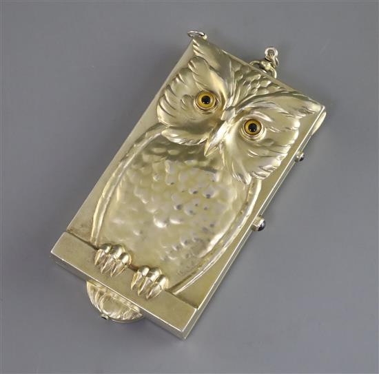 A rare early 20th century sterling silver gilt novelty compact, decorated with an owl on a perch, 11.8cm.